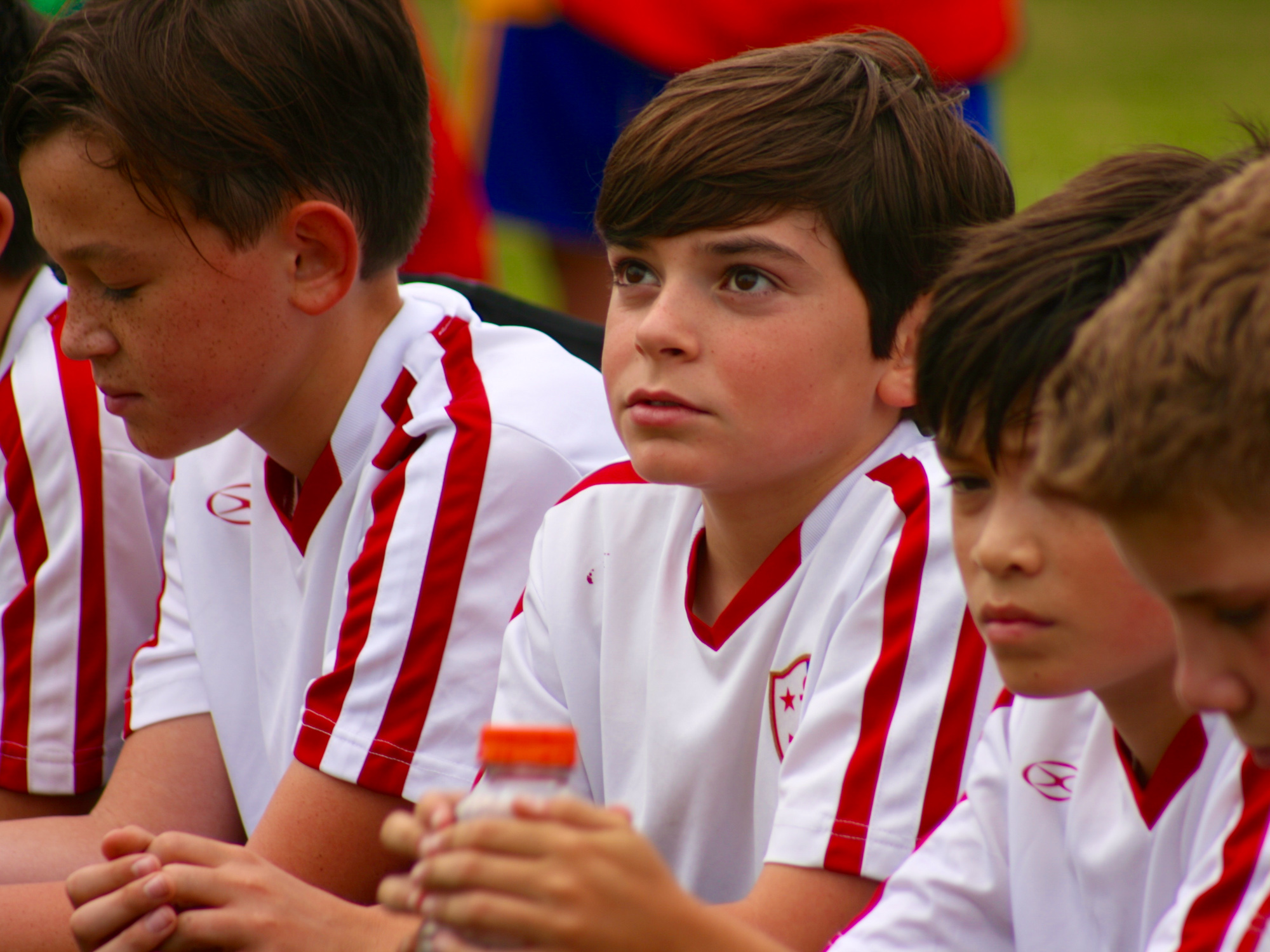 boys listening to coach at half time