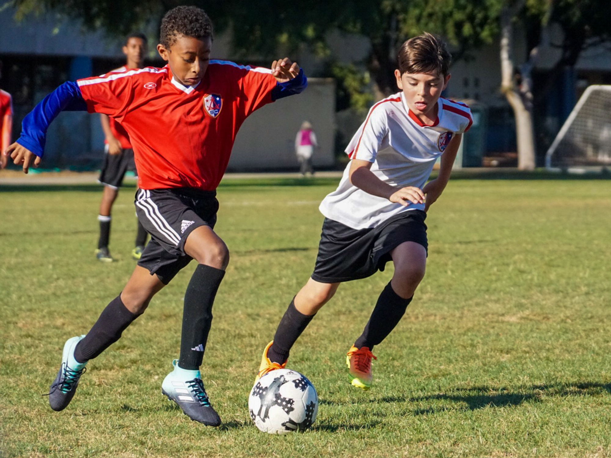 2 boys competing for the ball